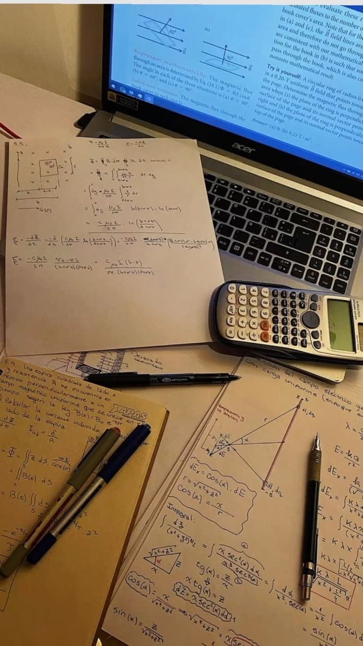 Handwritten calculations, a calculator and a laptop