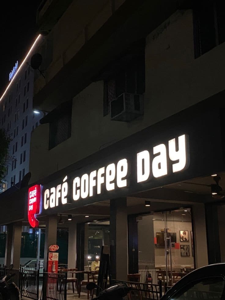A café storefront at night