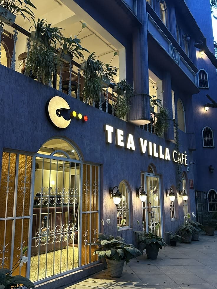 A café terrace lit up in the evening